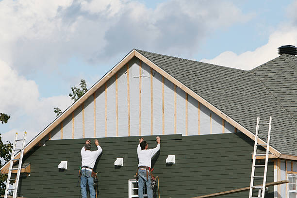 Professional Siding technician working in Saint Stephens Church, VA